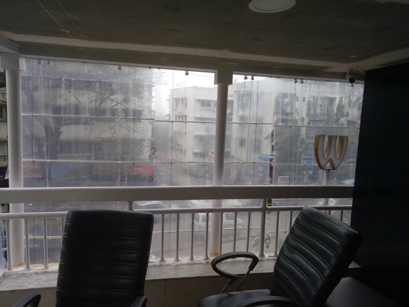 Clear monsoon blinds closing off a balcony