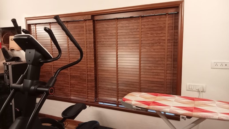 Wooden venetian blinds in a home gym